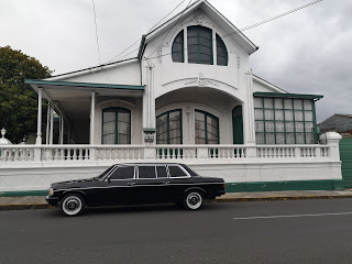 GREENANDWHITEMANSION.CARTAGOCOSTARICAMERCEDESLIMOUSINETRANSPORTATION.jpg